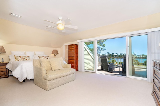 carpeted bedroom featuring lofted ceiling, access to outside, visible vents, and a ceiling fan