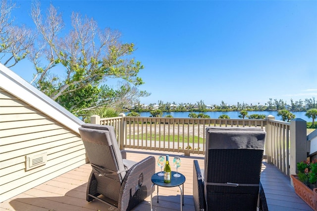 deck featuring a water view