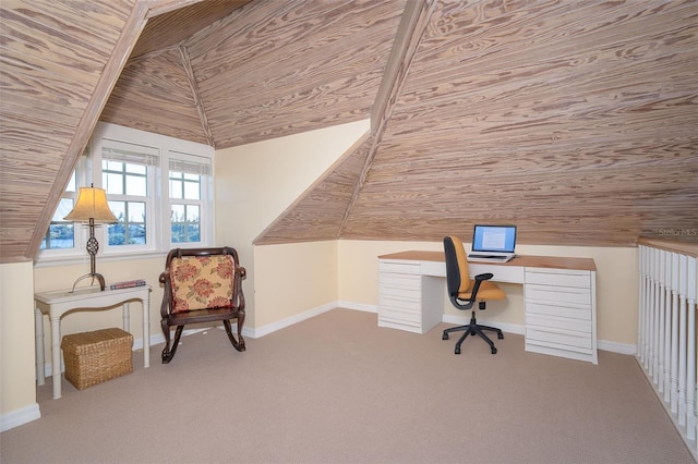 unfurnished office with vaulted ceiling, carpet floors, wood ceiling, and baseboards