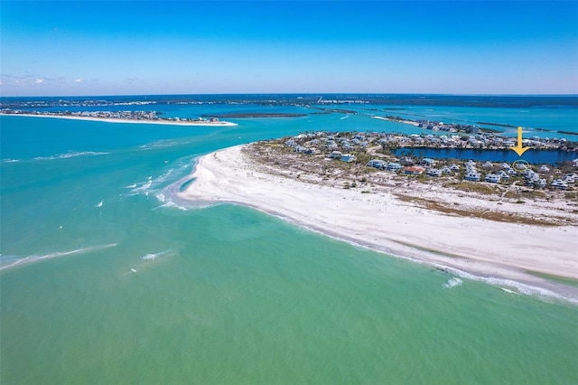 bird's eye view featuring a water view and a view of the beach