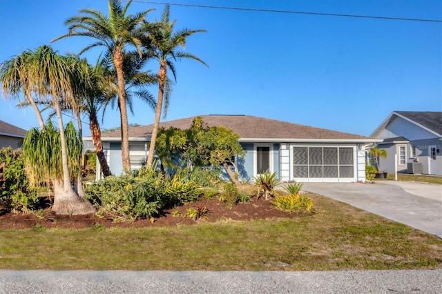 single story home with central air condition unit, driveway, and an attached garage