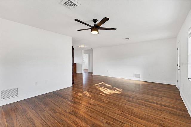 unfurnished room featuring visible vents, ceiling fan, and wood finished floors