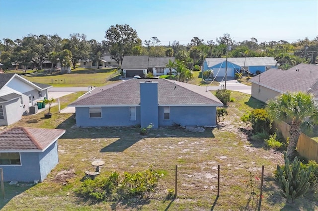 birds eye view of property with a residential view