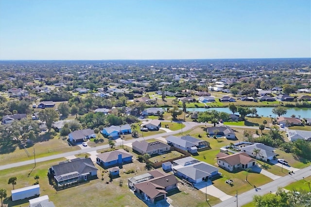 bird's eye view featuring a residential view and a water view