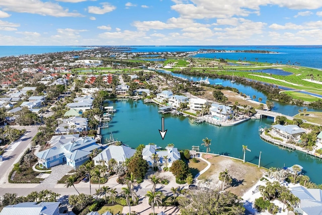 drone / aerial view featuring a water view and a residential view