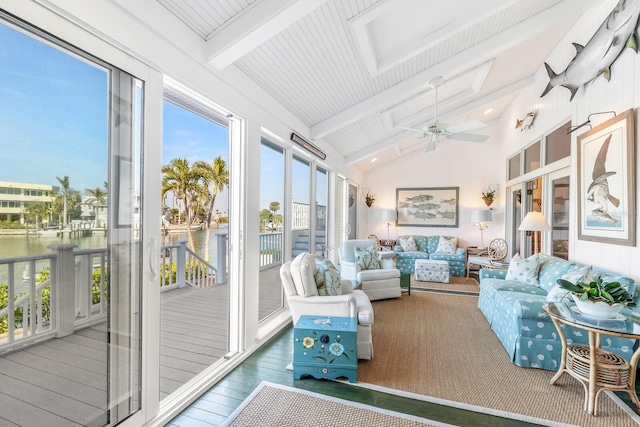 sunroom / solarium featuring ceiling fan and lofted ceiling with beams