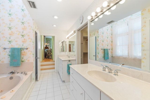 bathroom with wallpapered walls, visible vents, and a sink