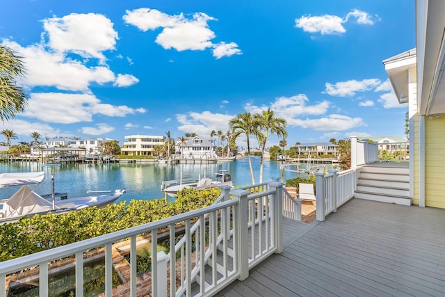 deck featuring a water view and a dock