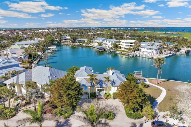 aerial view with a water view and a residential view