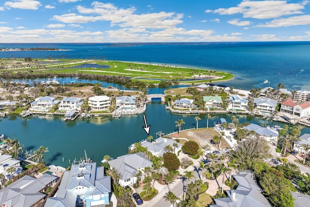 drone / aerial view featuring a water view and a residential view