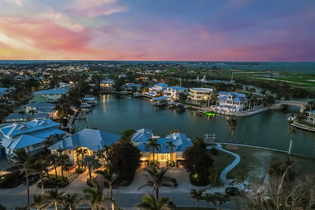 aerial view at dusk with a water view