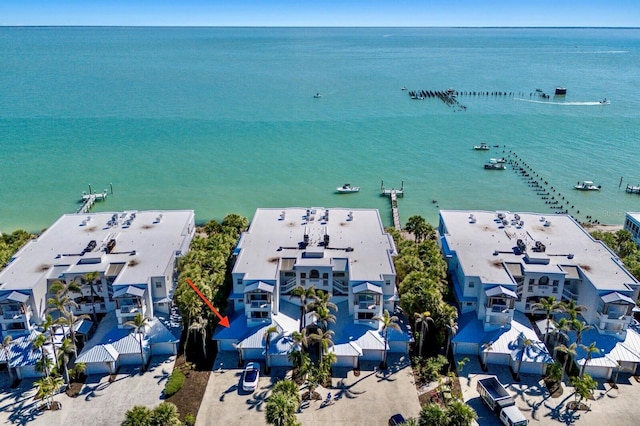 bird's eye view featuring a residential view and a water view