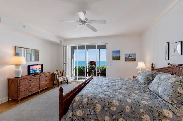 bedroom with access to exterior, crown molding, a ceiling fan, wood finished floors, and baseboards