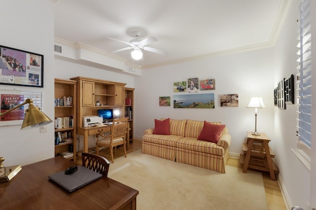 interior space with visible vents, ornamental molding, a ceiling fan, and baseboards