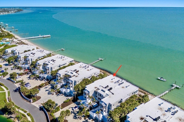 birds eye view of property with a water view and a residential view