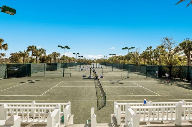 view of sport court with fence