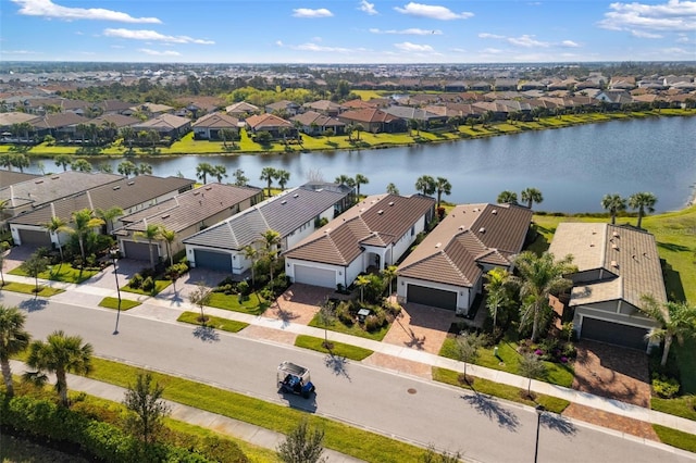 aerial view with a water view and a residential view