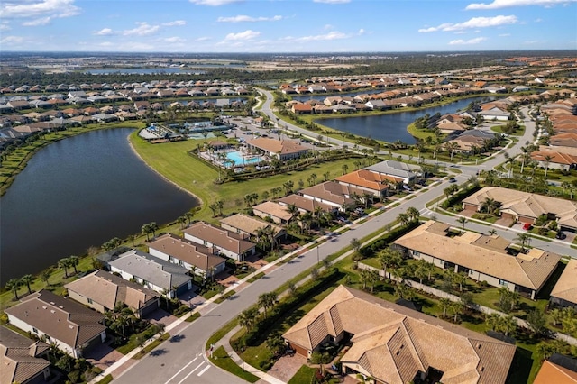 bird's eye view featuring a water view and a residential view