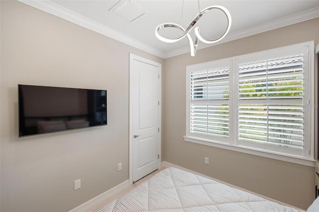13137 Oriago St, Venice, FL 34293 - bedroom featuring baseboards, visible vents, multiple windows, and crown molding