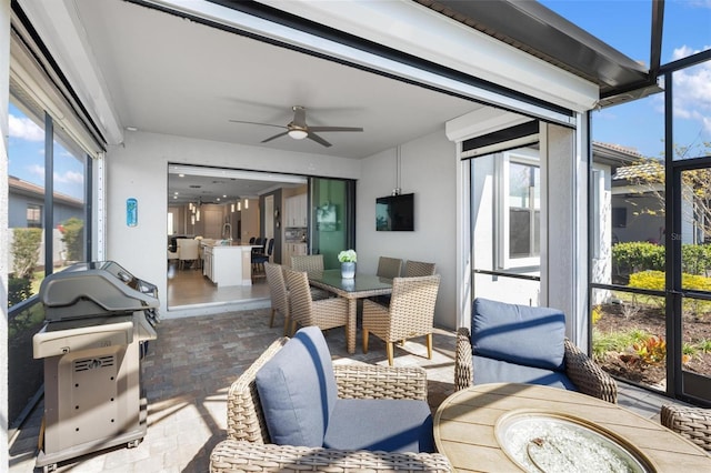 13137 Oriago St, Venice, FL 34293 - sunroom with outdoor dining area and a ceiling fan