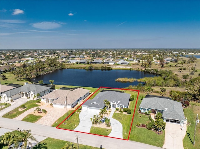 aerial view featuring a water view and a residential view