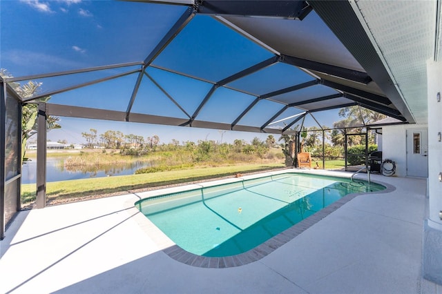 pool featuring a lanai, a patio area, and a water view