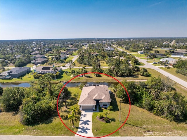 bird's eye view with a residential view and a water view