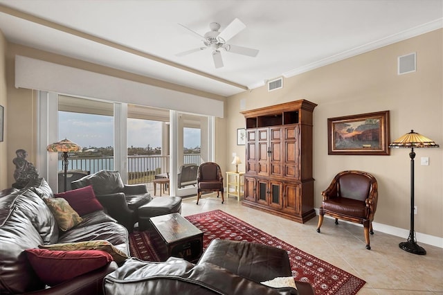 living room featuring ornamental molding, visible vents, baseboards, and light tile patterned flooring