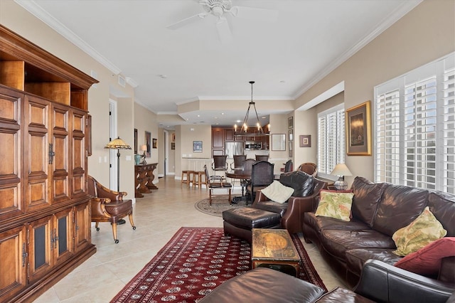 living room with light tile patterned floors, ceiling fan with notable chandelier, visible vents, and crown molding