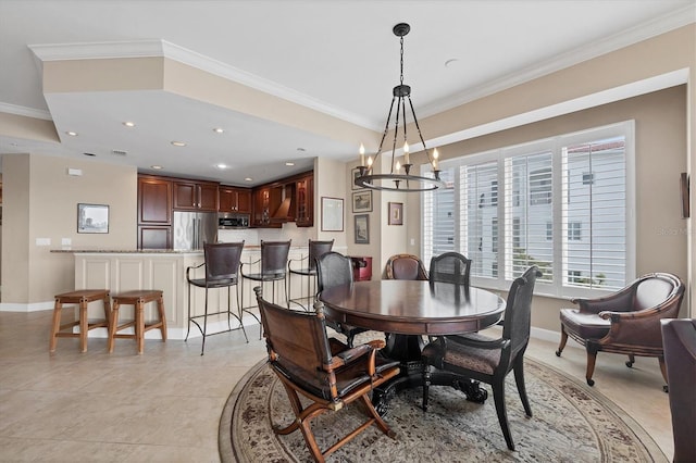 dining room with baseboards, a chandelier, crown molding, and recessed lighting