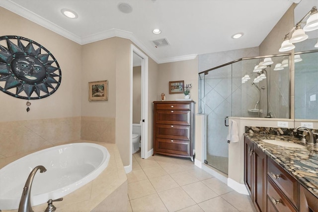 bathroom with visible vents, crown molding, a shower stall, and a garden tub