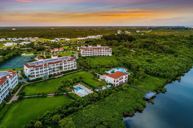 aerial view at dusk with a water view