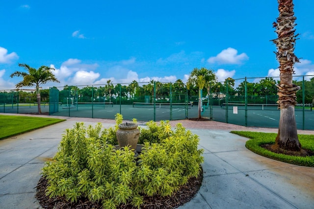 view of sport court featuring fence