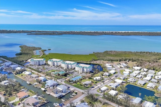 aerial view with a residential view and a water view