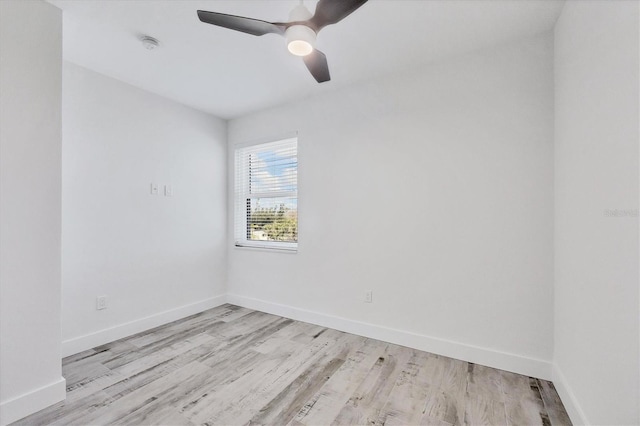 empty room featuring light wood-style flooring, baseboards, and ceiling fan