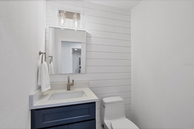 bathroom with toilet and vanity