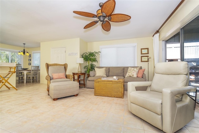 living room with light tile patterned floors and ceiling fan