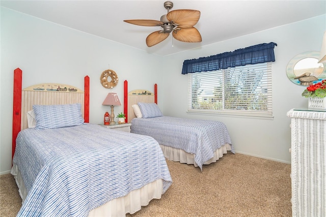 bedroom featuring a ceiling fan, light colored carpet, and baseboards