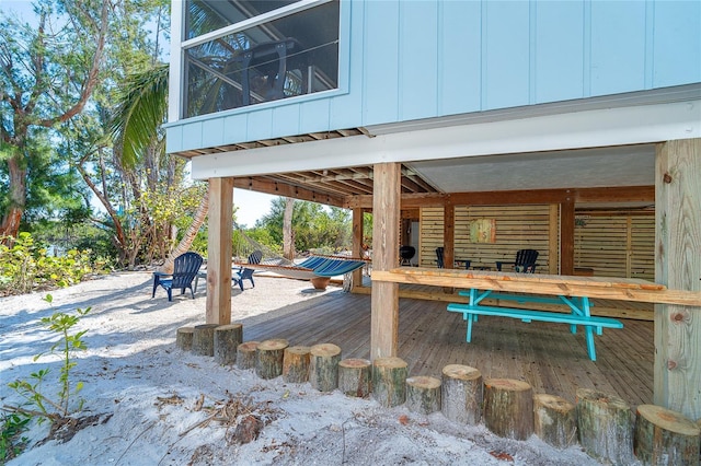 wooden terrace with outdoor dining area