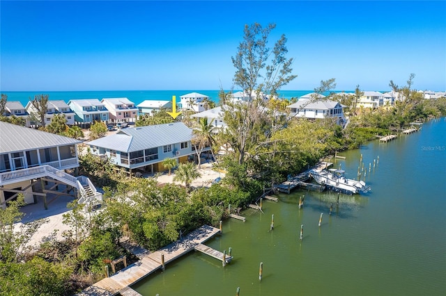 bird's eye view with a residential view and a water view