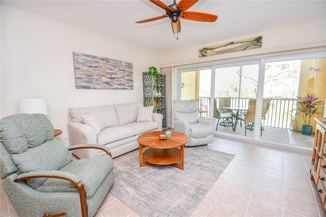 living room featuring a ceiling fan and light tile patterned flooring