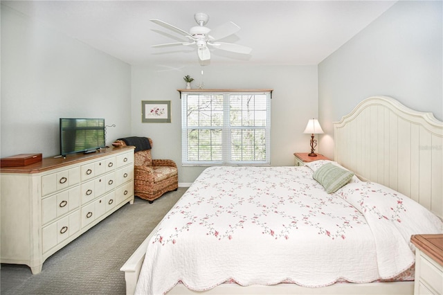 bedroom with a ceiling fan and carpet flooring