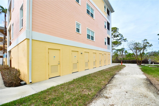 view of side of home featuring stucco siding