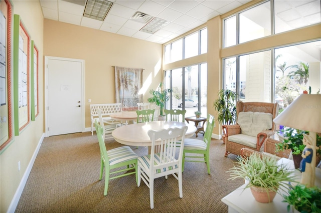 sunroom / solarium with a drop ceiling and visible vents