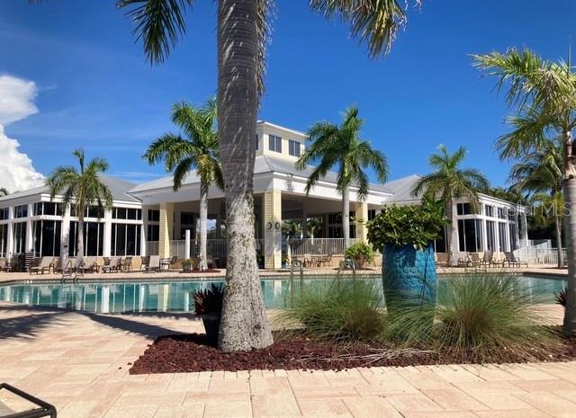 pool featuring a patio and fence