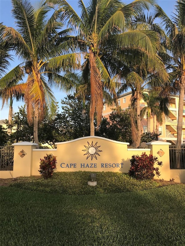 community / neighborhood sign with a yard