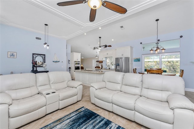 living room with recessed lighting, visible vents, and ceiling fan with notable chandelier