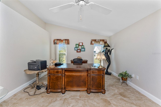 home office with baseboards, a ceiling fan, and vaulted ceiling