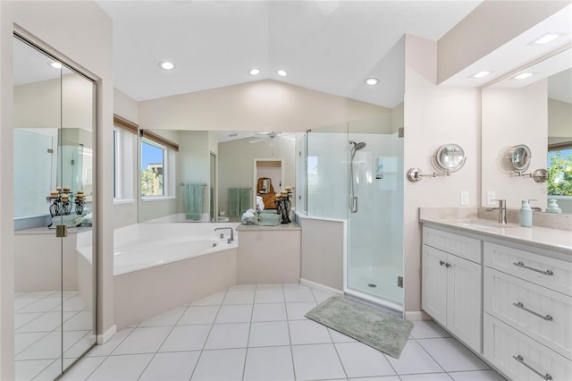 full bathroom with a garden tub, lofted ceiling, a stall shower, vanity, and a ceiling fan