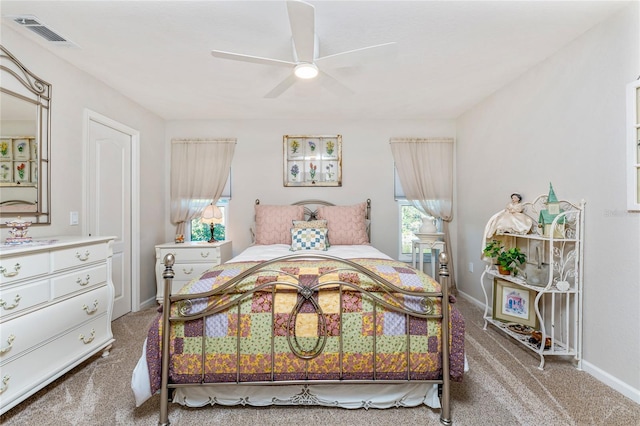 bedroom with a ceiling fan, baseboards, visible vents, and carpet floors